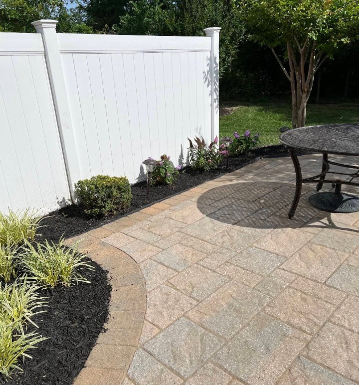 Paver patio after cleaning and landscape bed refresh